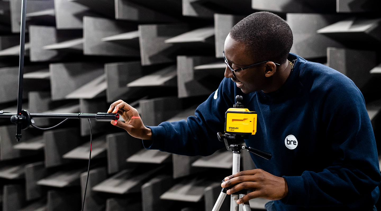 Technician setting up test in anechoic chamber at BRE
