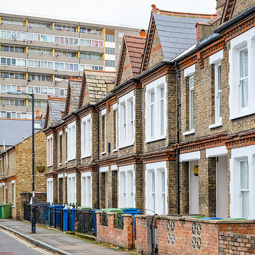 Row of Victorian terraces, with 1960s flats in the background