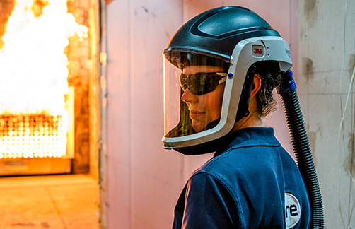 Technician in protective helmet in BRE Burn Hall